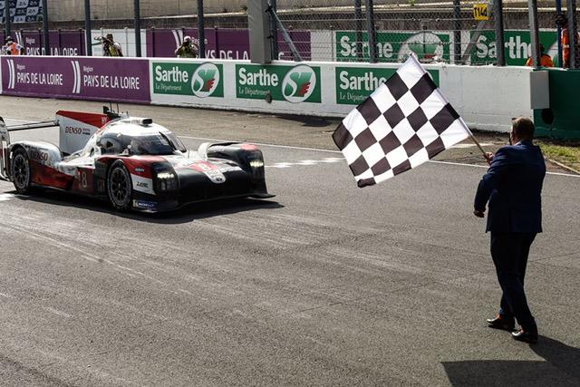 The Toyota TS050 driven by Kazuki Nakajima takes the flag at Le Mans yesterday