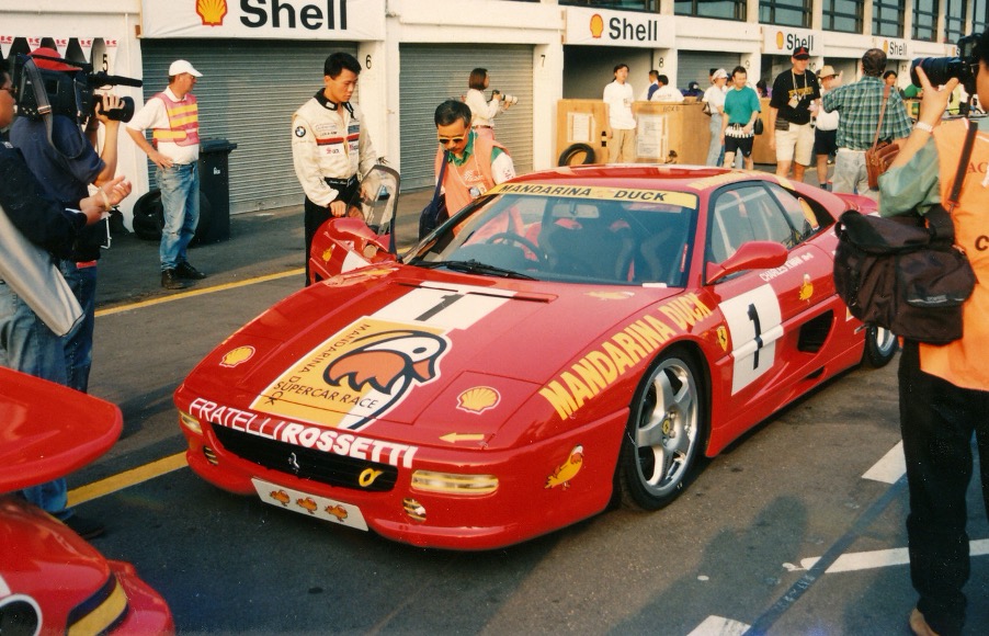 Charles Kwan, standing on the left of the car about to give the Ferrari 355 its first ever race. Macau GT race 1994