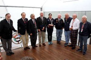 Monisha Kaltenborn receives the Jean Sage Memorial Award from President Howden Ganley and joined by,left to right, General Secretary Theo Huschek ,Antoine Seyler, Nannni Galli, Howden, Monisha, Teddy Pilette, Patrick Tambay, Sir Jackie Stewart and Jos Vonlanthen. (Photo Axel Schmidt)