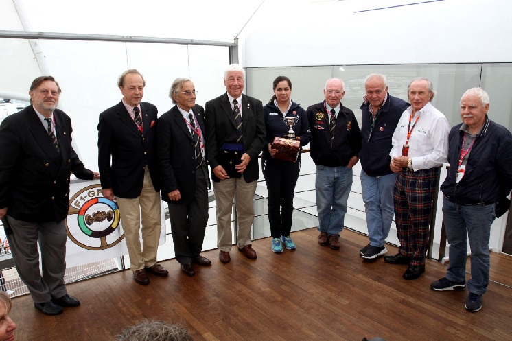 Monisha Kaltenborn receives the Jean Sage Memorial Award from President Howden Ganley and joined by,left to right, General Secretary Theo Huschek ,Antoine Seyler, Nannni Galli, Howden, Monisha, Teddy Pilette, Patrick Tambay, Sir Jackie Stewart and Jos Vonlanthen. (Photo Axel Schmidt)