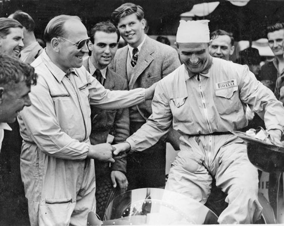 Reg Parnell, left, with another early member of the Grand Prix Drivers Club, “Nino” Farinaa whilst future member, Tim Parnell, stands tall in the background