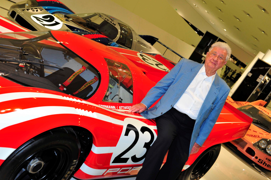 Hans Herrmann poses beside the Porsche 917 that he and fellow Grand Prix Drivers Club member Richard Attwood gave Porsche their first outright win at the Le Mans 24 Hour race. ( Photo Grand Prix Photo/Peter Nygaard)