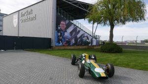 The renamed Jim Clark Grandstand beside the BRDC clubhouse and the Lotus 32B raced by Clark. (Photo Gauld)